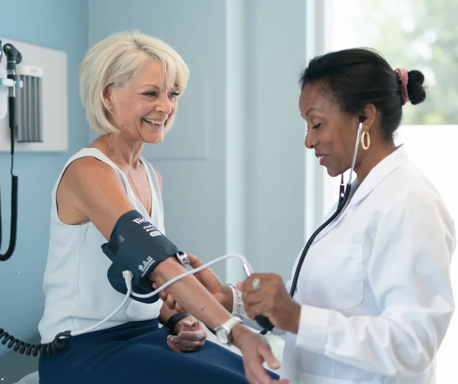 Healthcare professional checking a patient's blood pressure